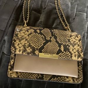 Michael Kors-NWT. Beautiful. Neutral Leather. 2 interior and 1 exterior pocket.